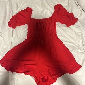 RED ROMPER IN NEW CONDITION size XS and only worn once